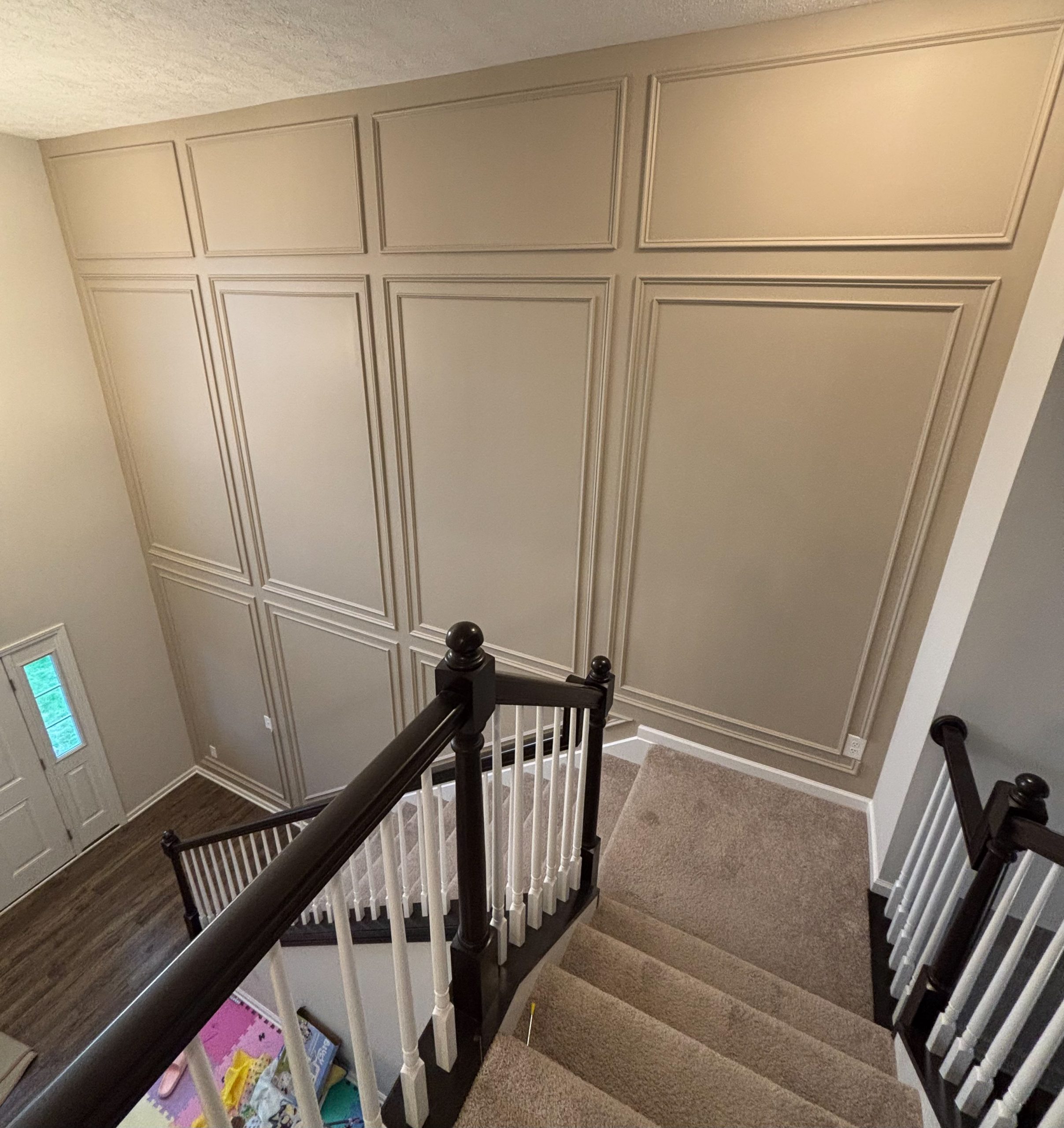 Image of an accent wall installation on a staircase by Robeko Home Improvement