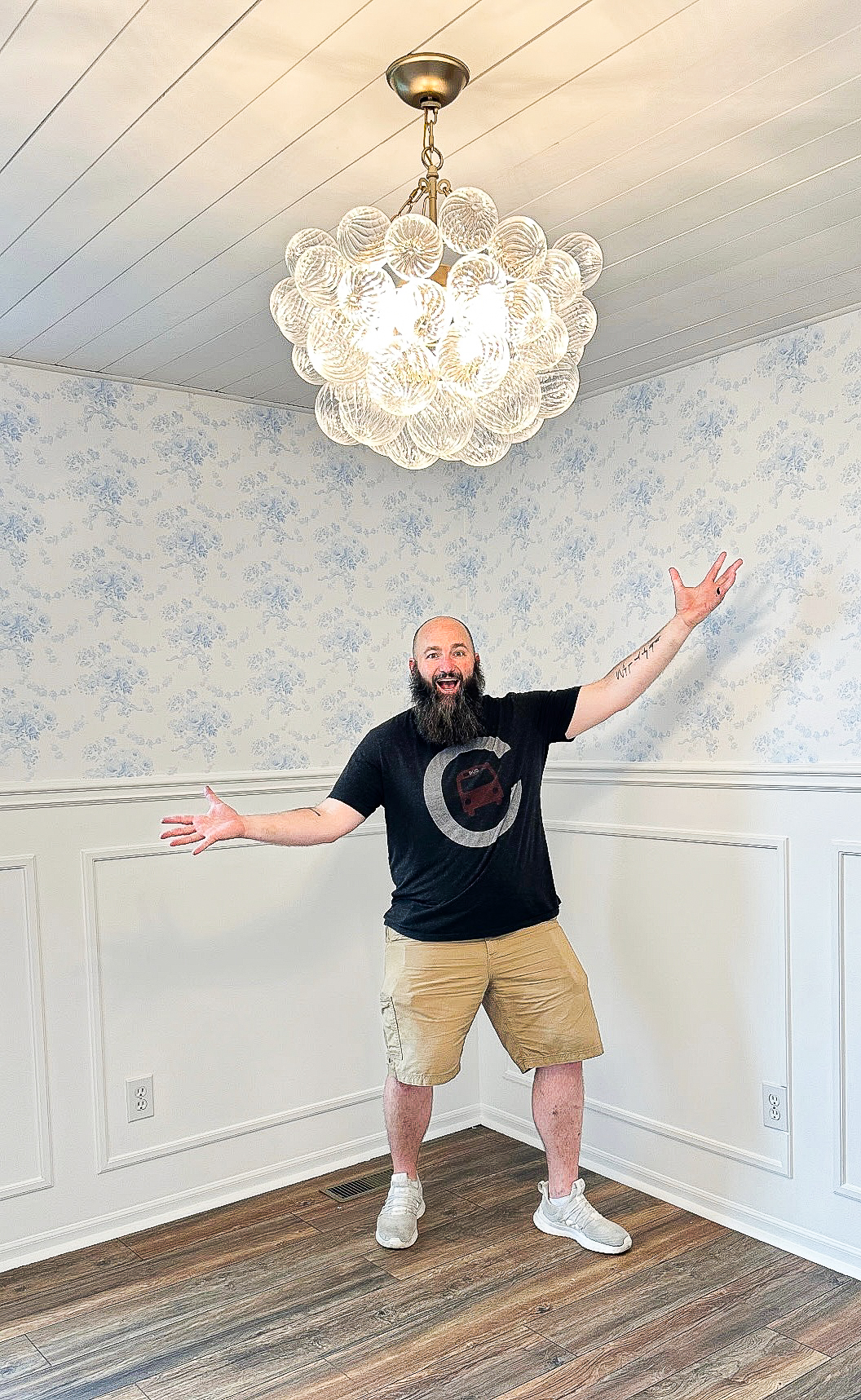 image of robeko owner, Kody Robertson in front of a recently installed wainscoting